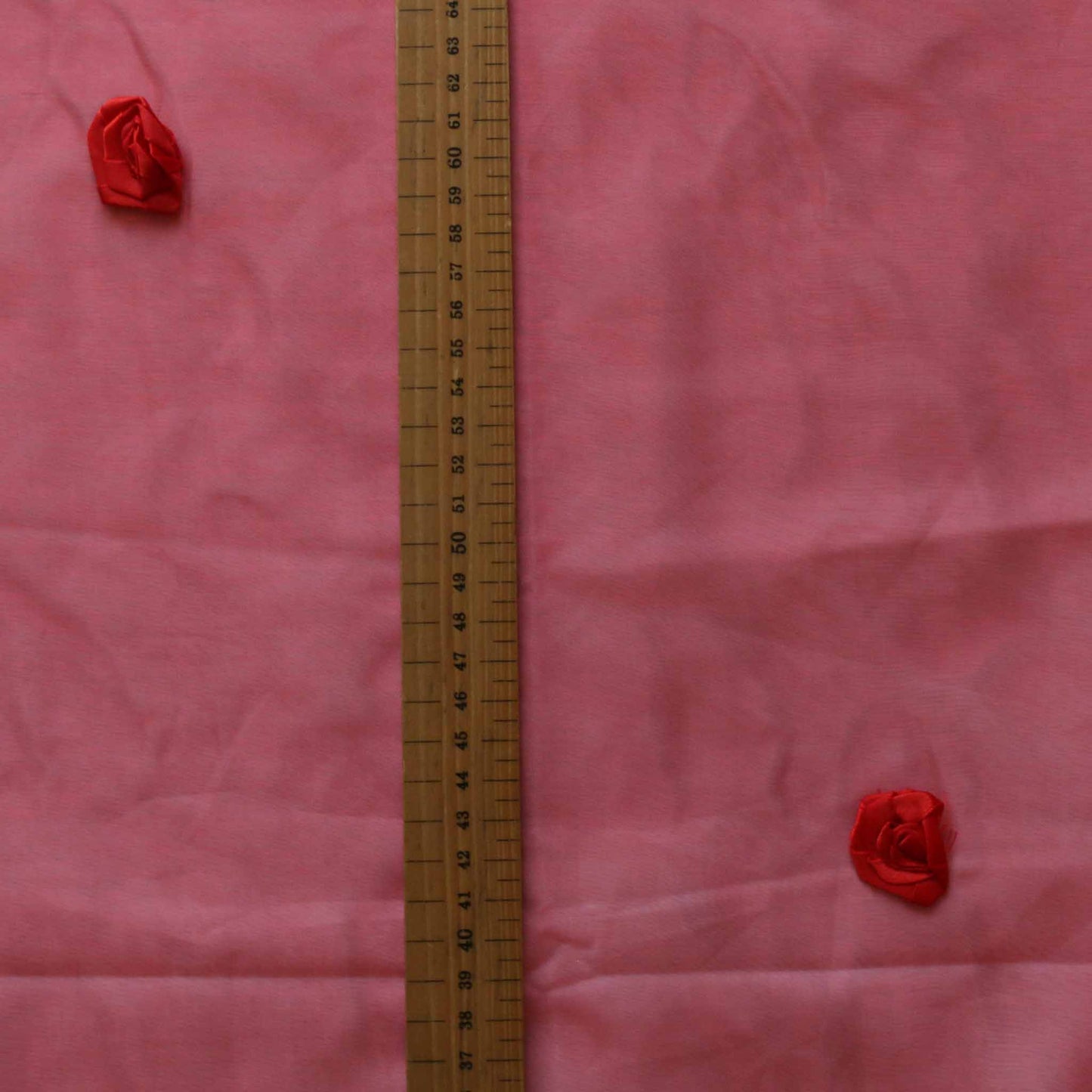 red organza fabric for dressmaking with red rose embellishment