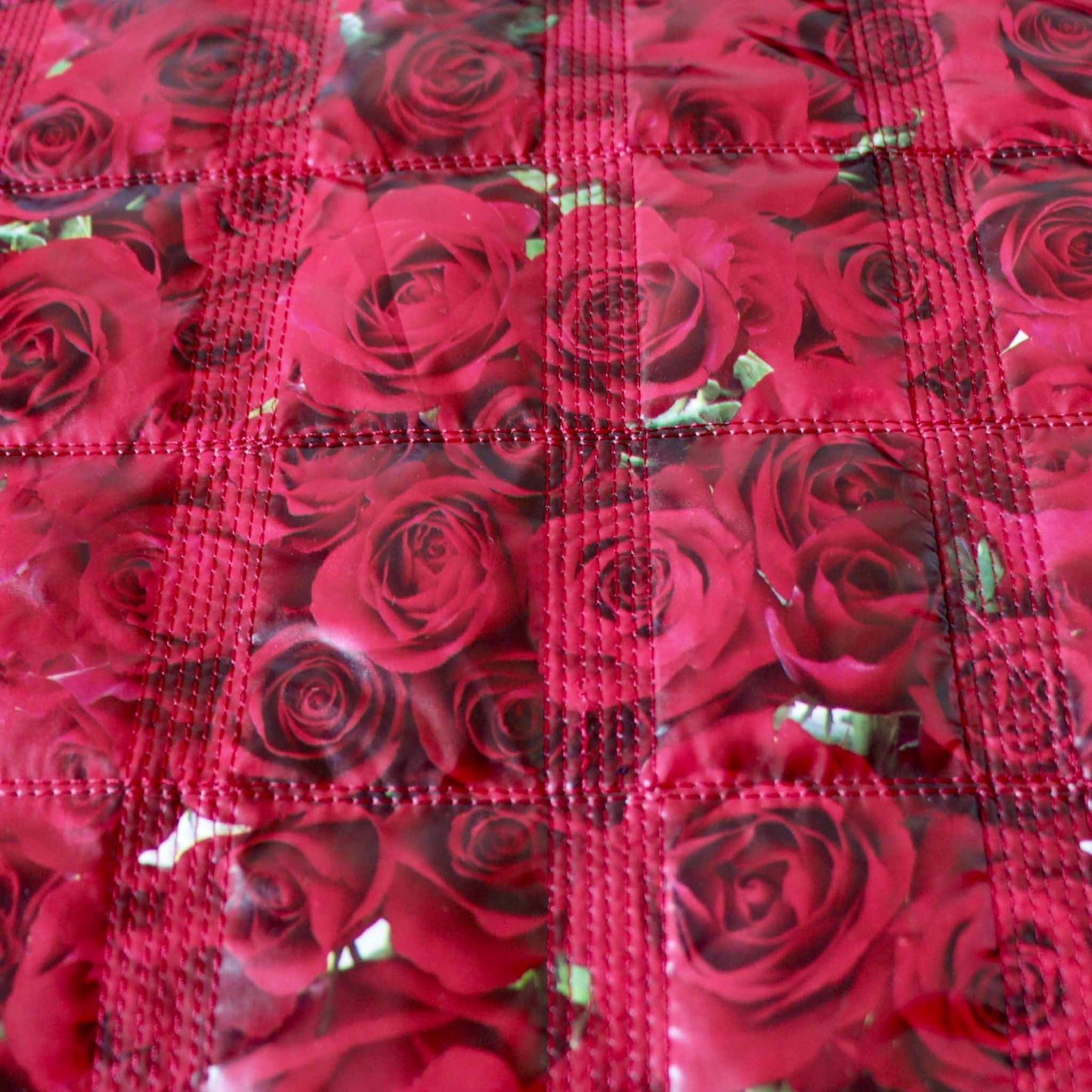 quilting dressmaking fabric in red with large rose design print