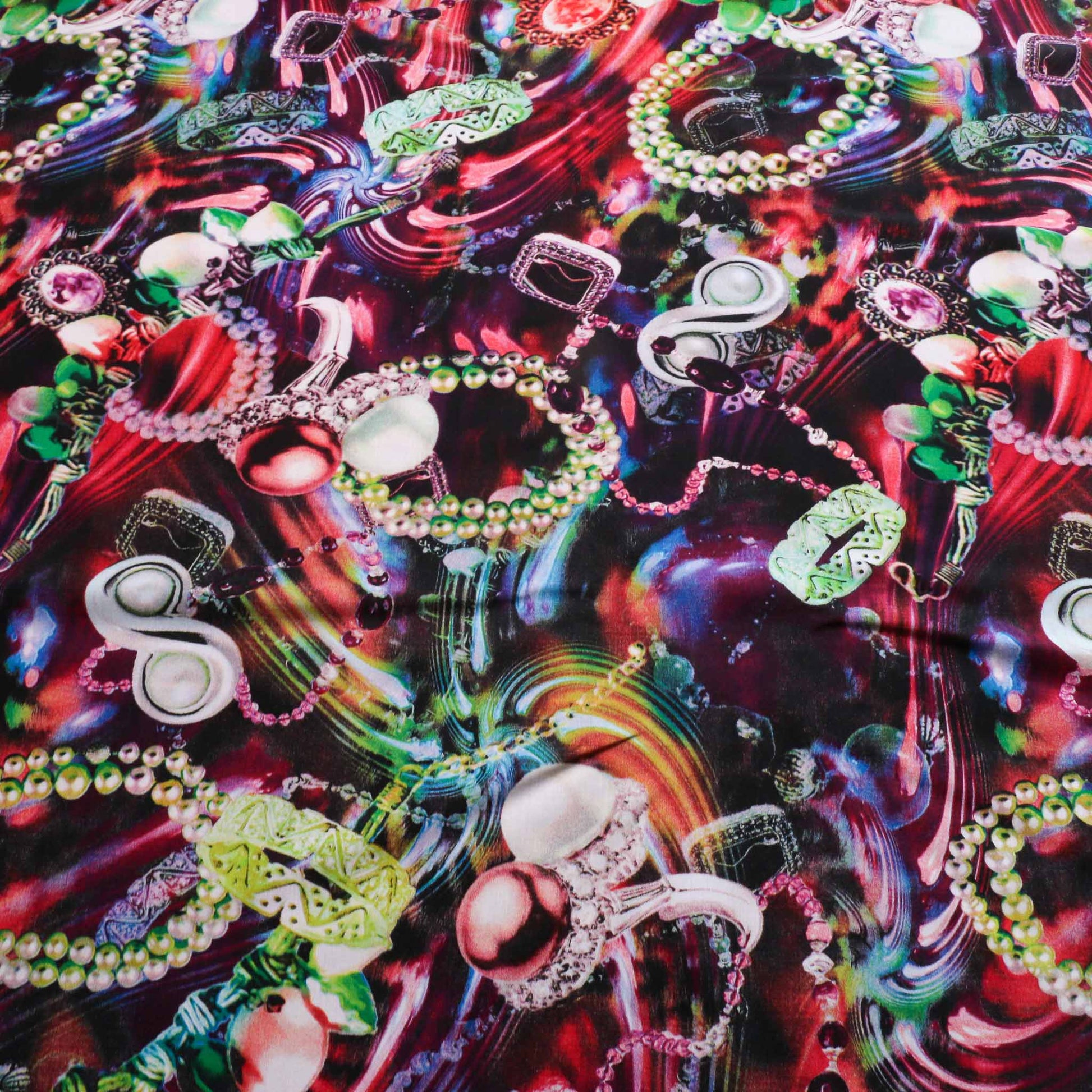 multicoloured viscose challis dressmaking rayon fabric with jewellery print in red green blue colours