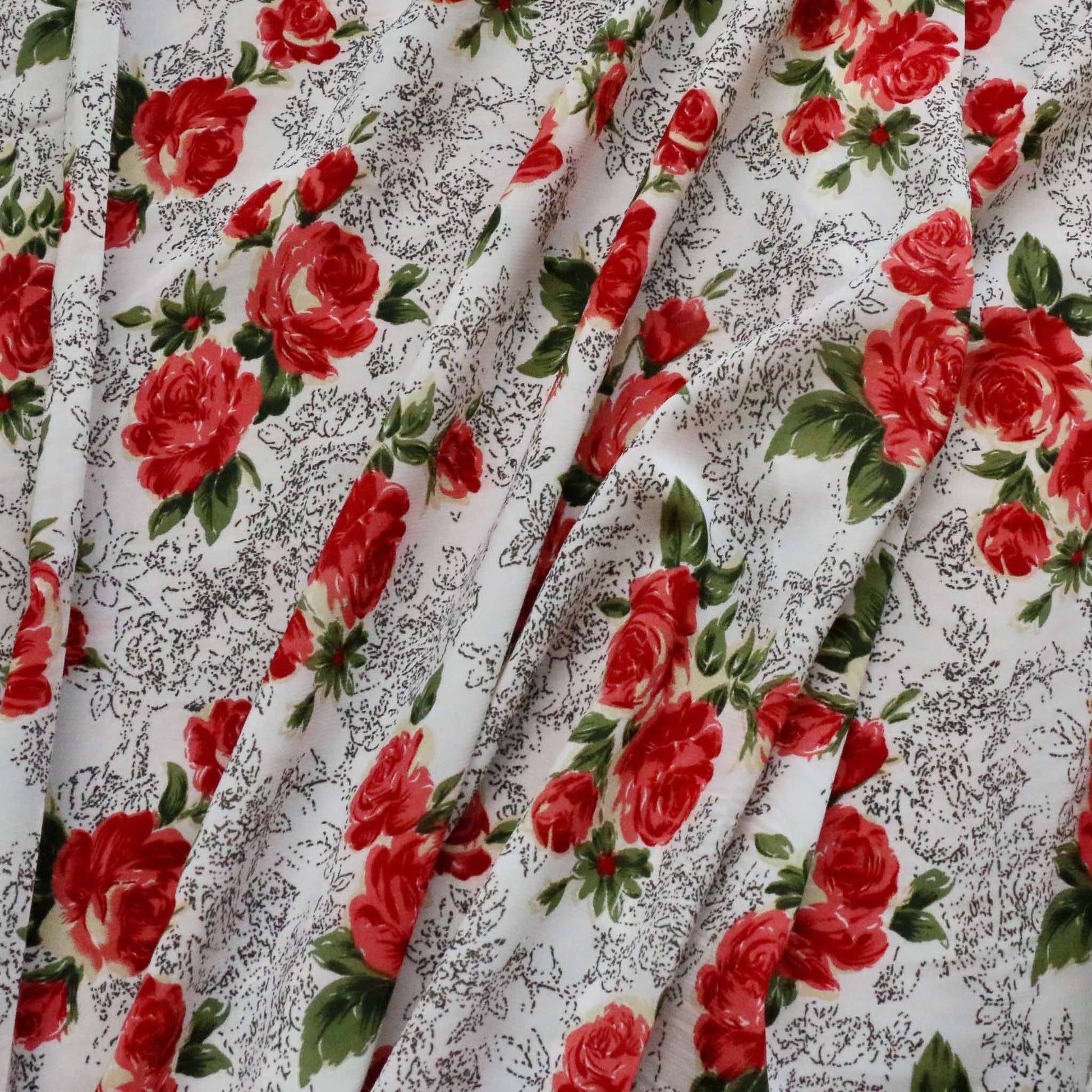 red rose flowers printed on white polyester chiffon dressmaking fabric