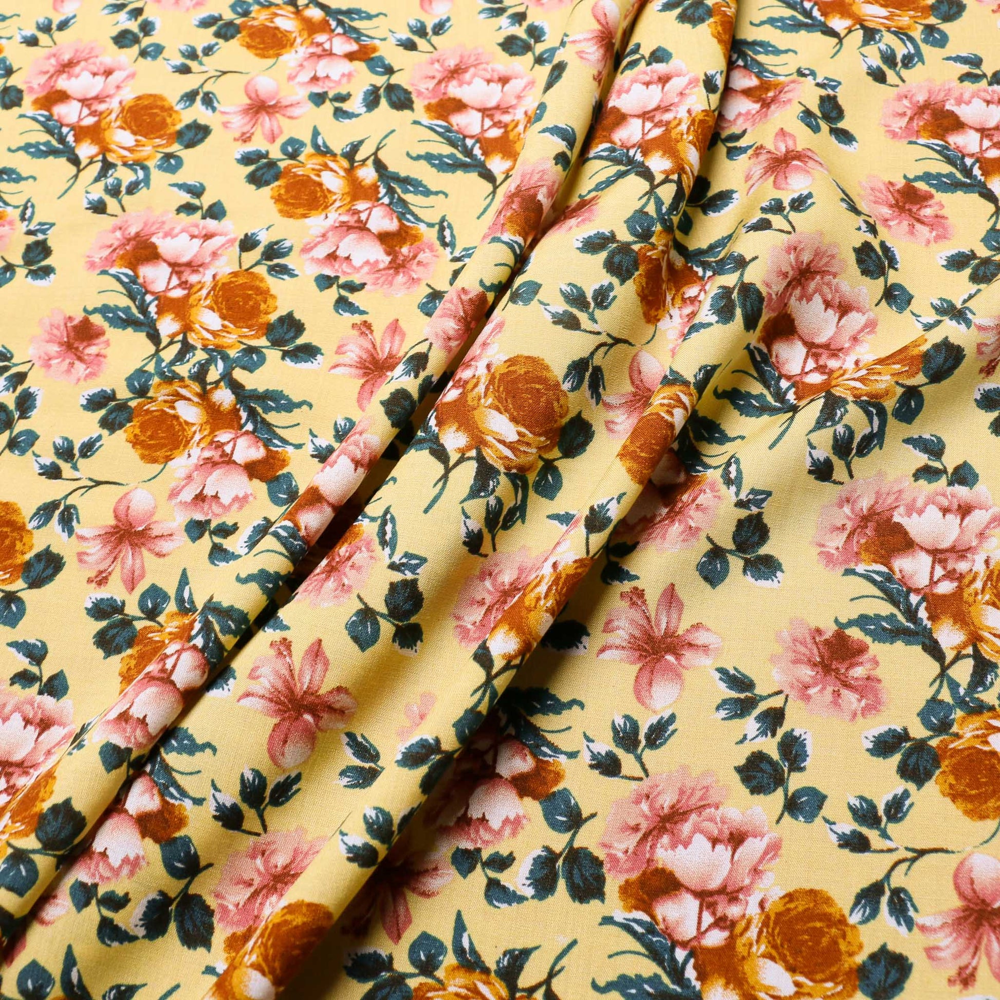 rose patterned viscose challis dressmaking fabric in yellow