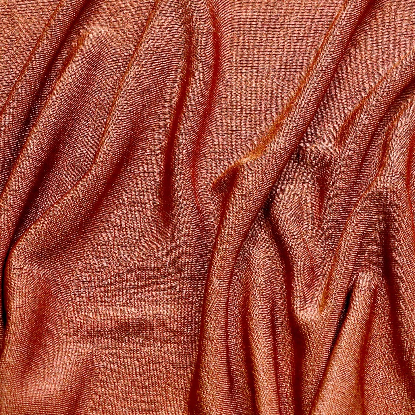 rusty colour orange slinky stretchy jersey dressmaking fabric