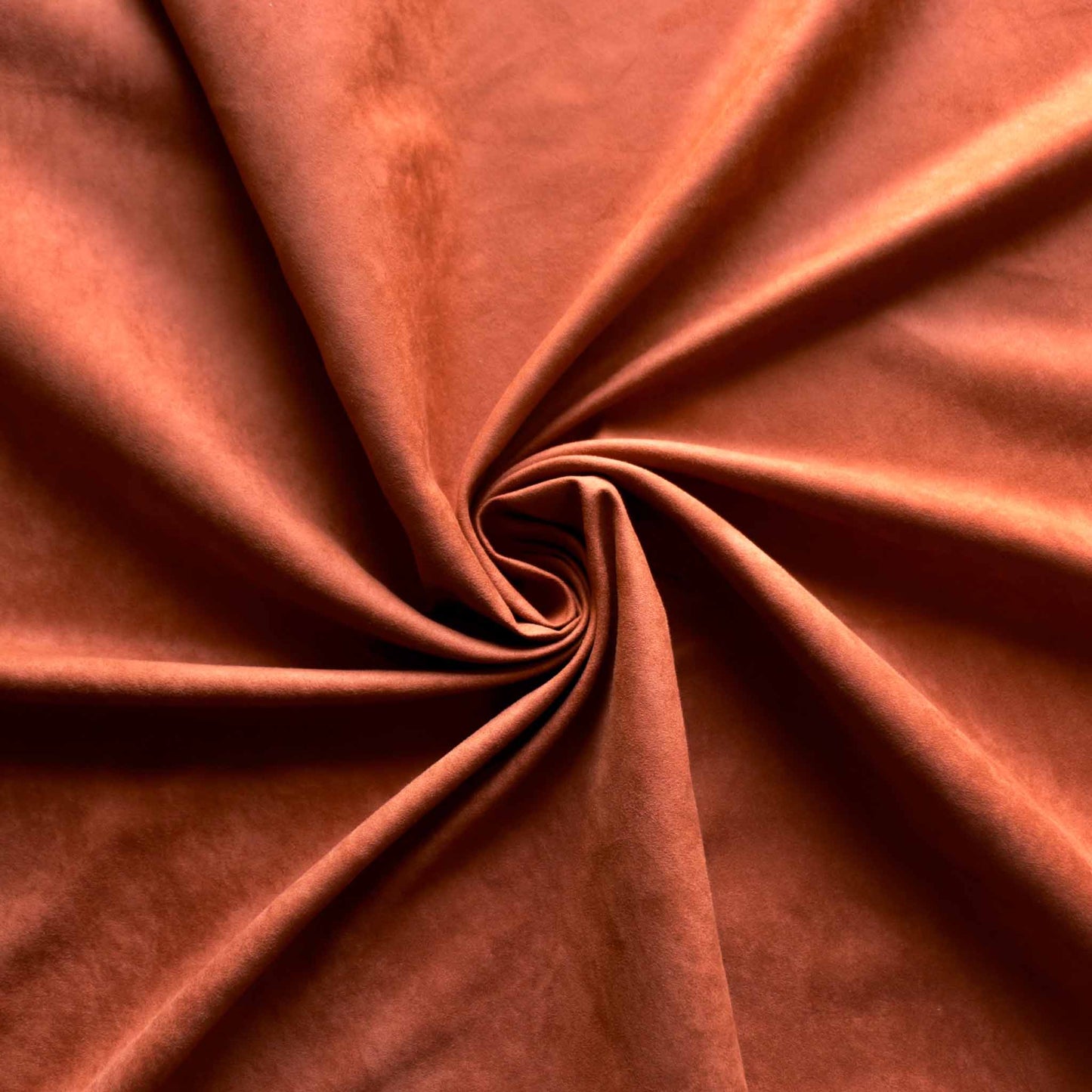 rust orange faux suede dressmaking fabric with satin back