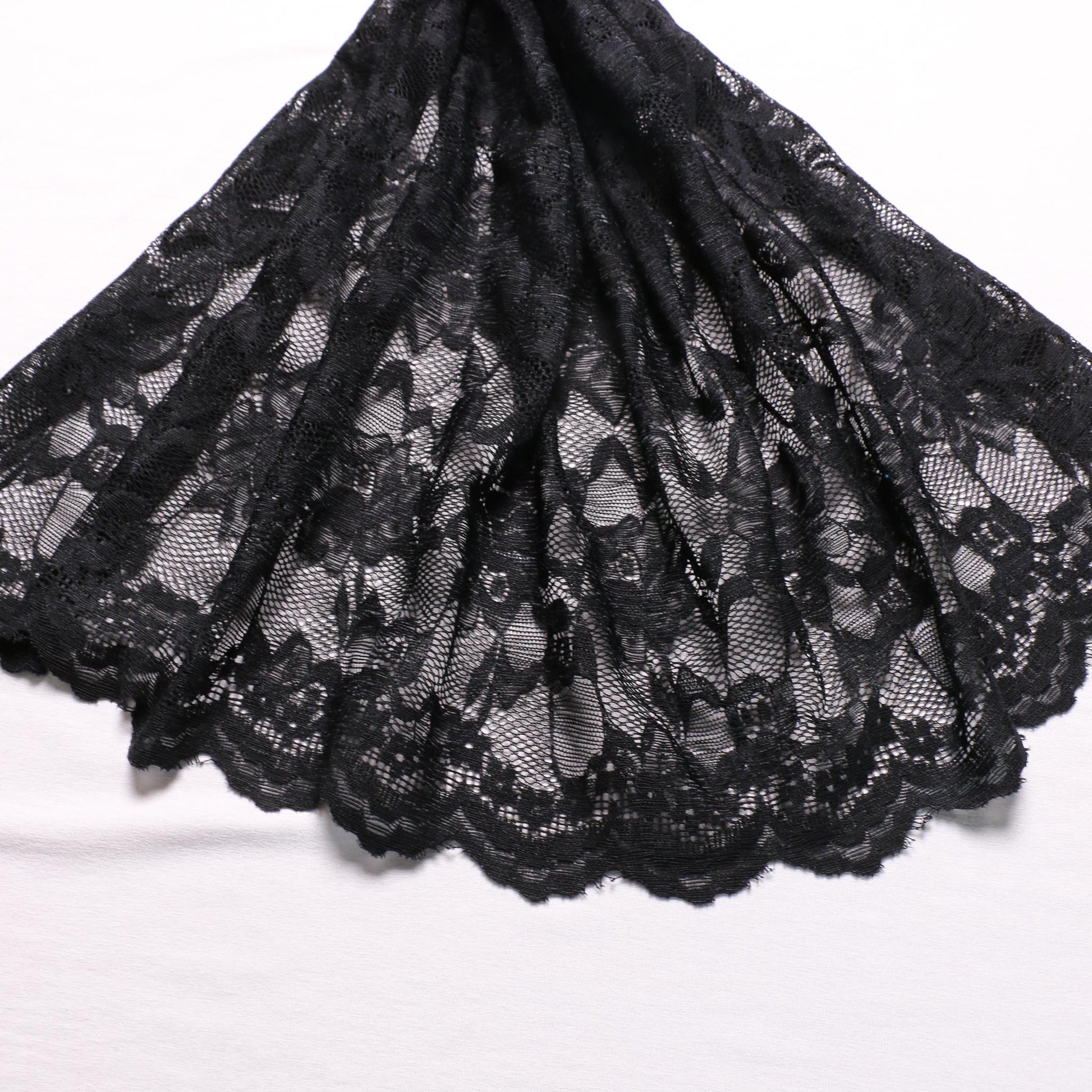 scalloped edge black corded lace dressmaking fabric