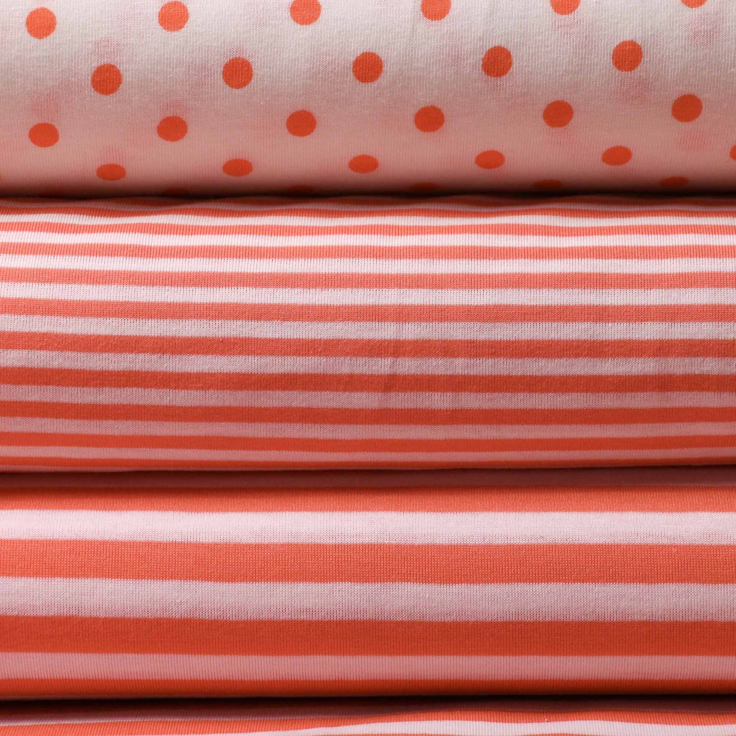 striped polkadot white and orange jersey dressmaking fabric