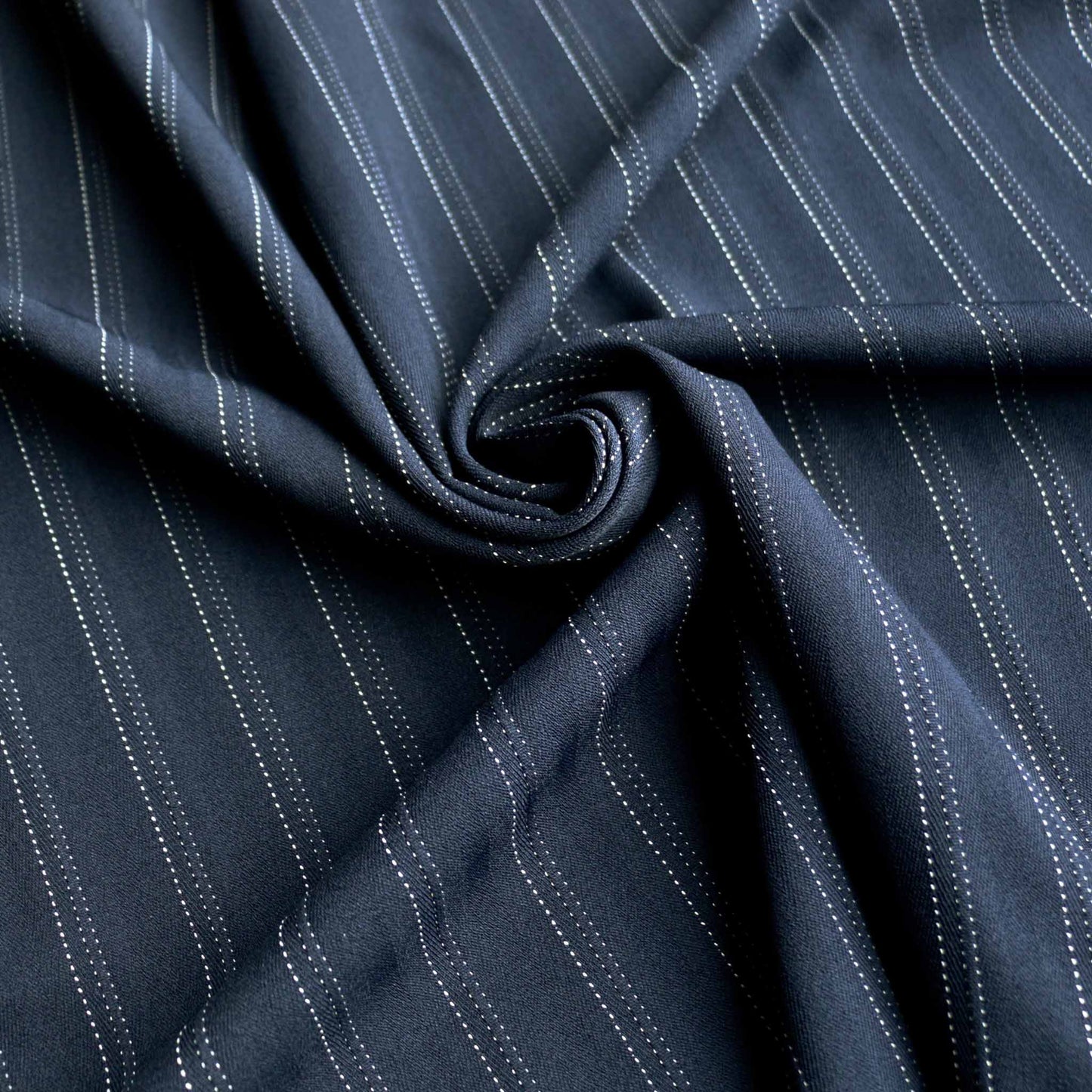 stretchy navy pinstripe suiting dressmaking fabric with white stripe on navy