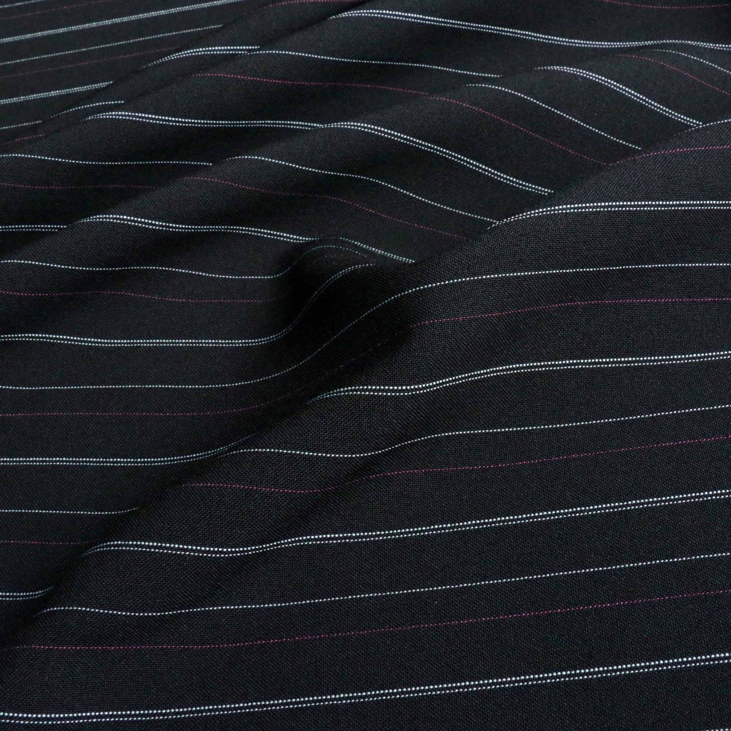 pink and white pinstripe on black stretchy suiting fabric