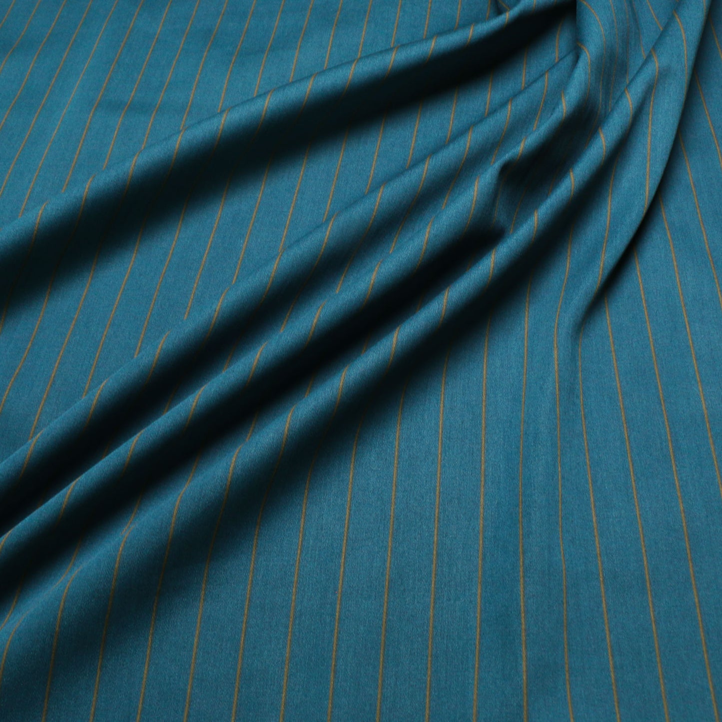 teal and beige dressmaking fabric with pinstripe