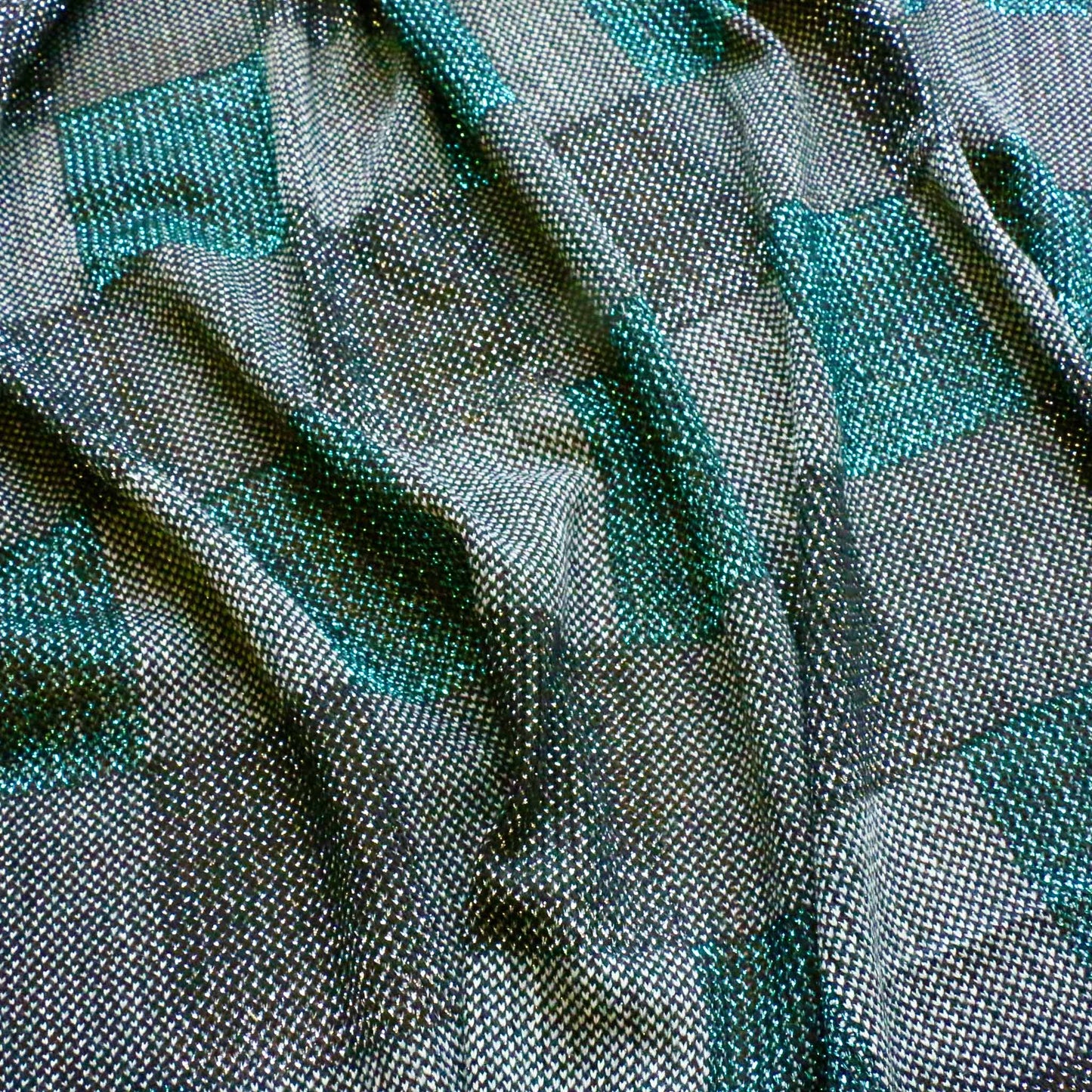 turquoise and black jersey knit dressmaking fabric with check design