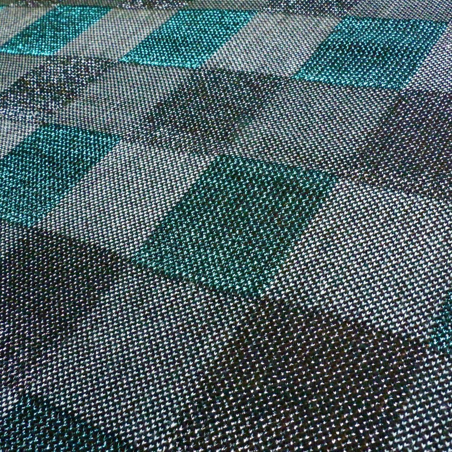 check patterned jersey knit dressmaking fabric in black and turquoise 