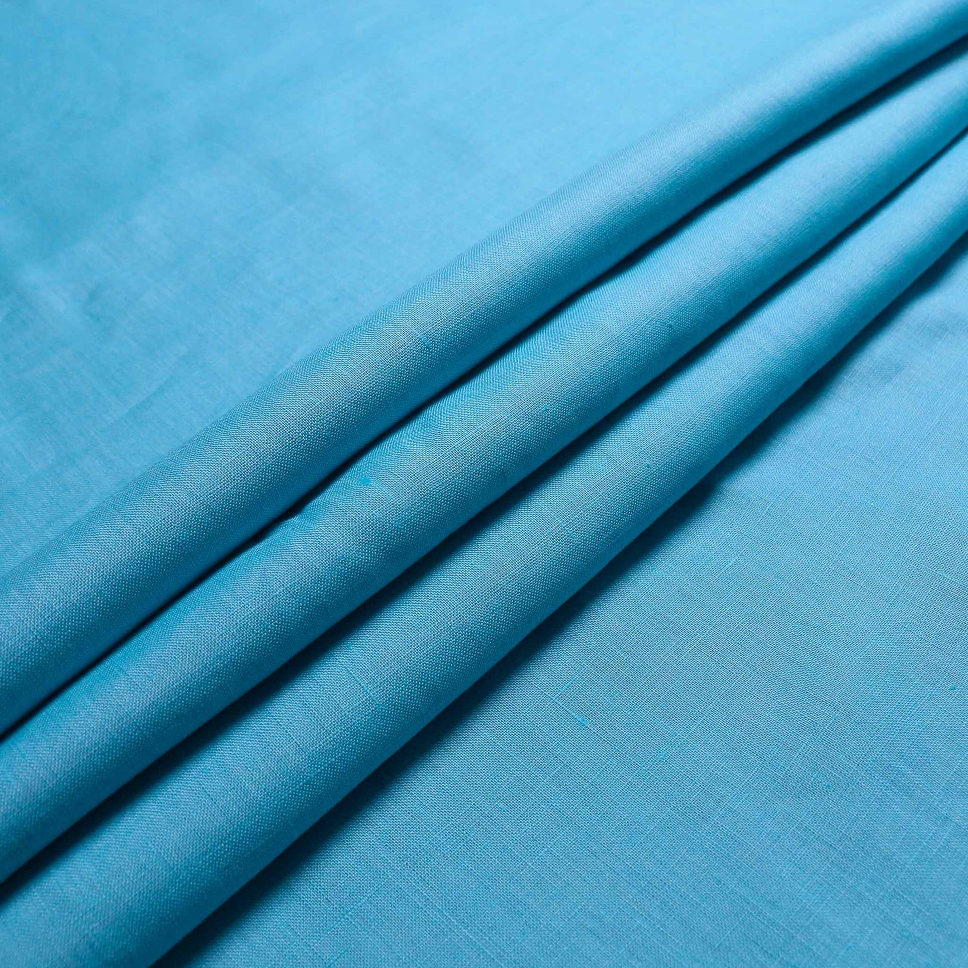linen viscose dressmaking fabric in plain pastel teal colour