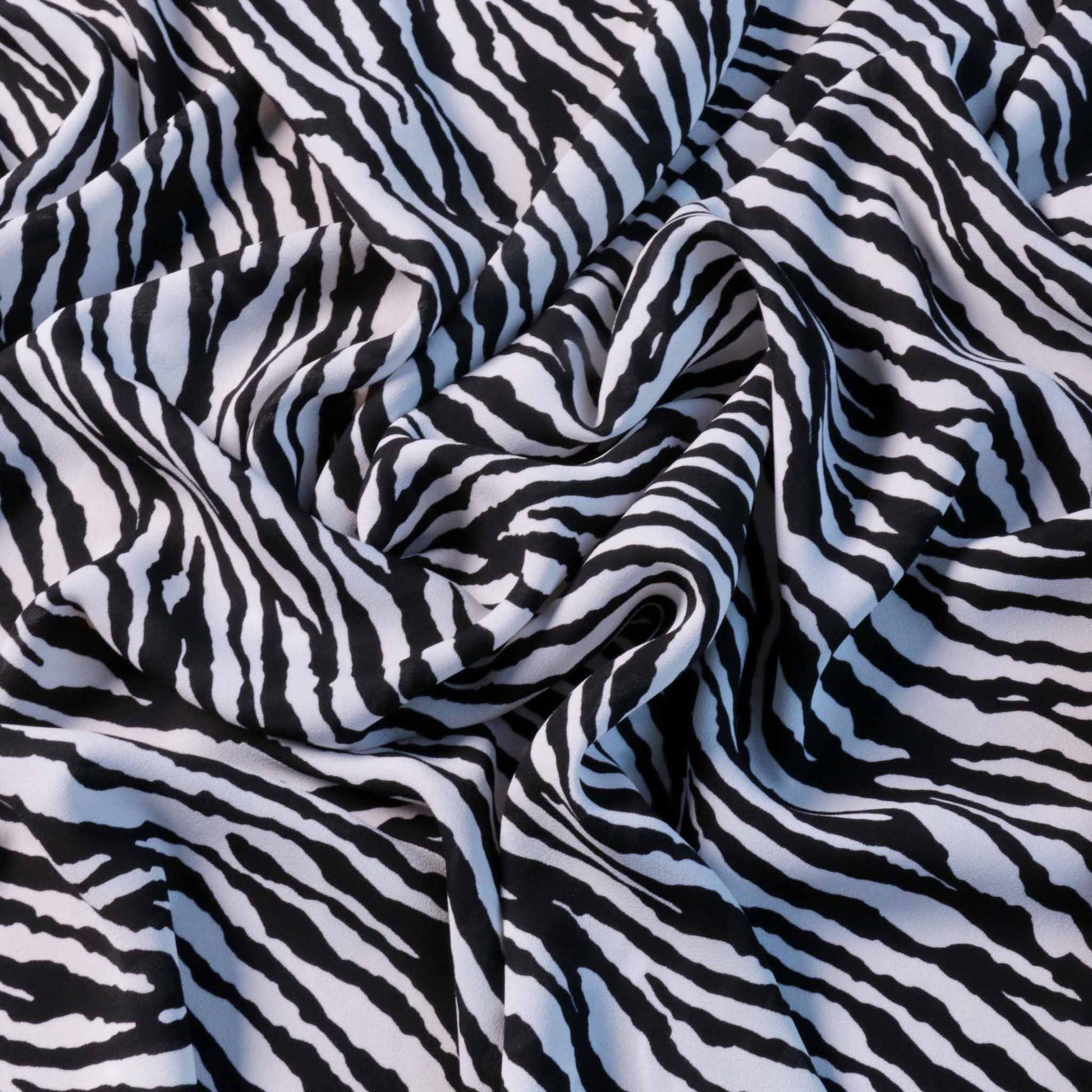 zebra animal print dressmaking fabric in white and black