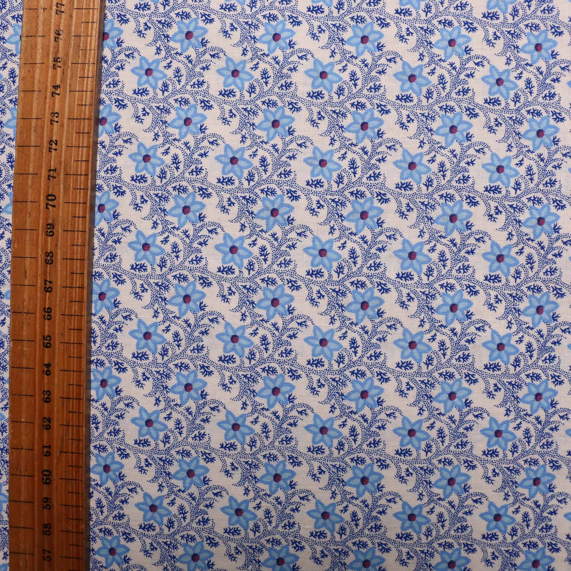 white vintage cotton dressmaking sustainable deadstock fabric with blue floral print