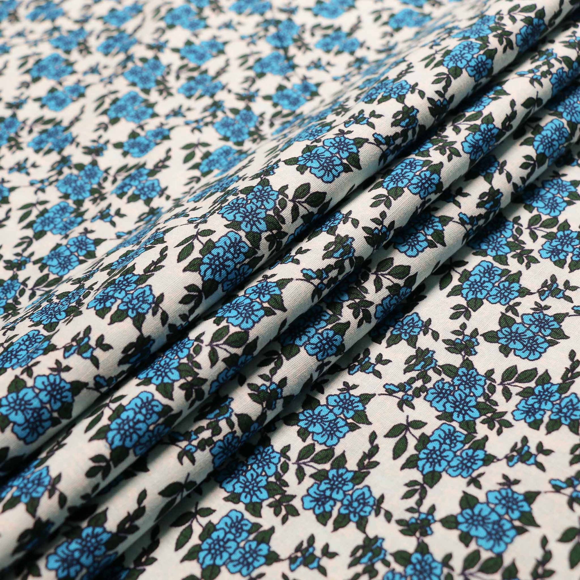 pale blue vintage cotton dressmaking sustainable deadstock fabric with blue floral print