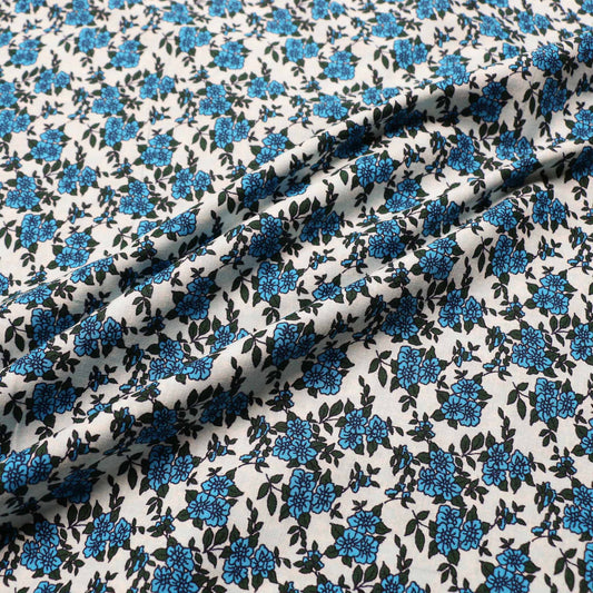 vintage cotton dressmaking fabric in pale blue with blue floral print