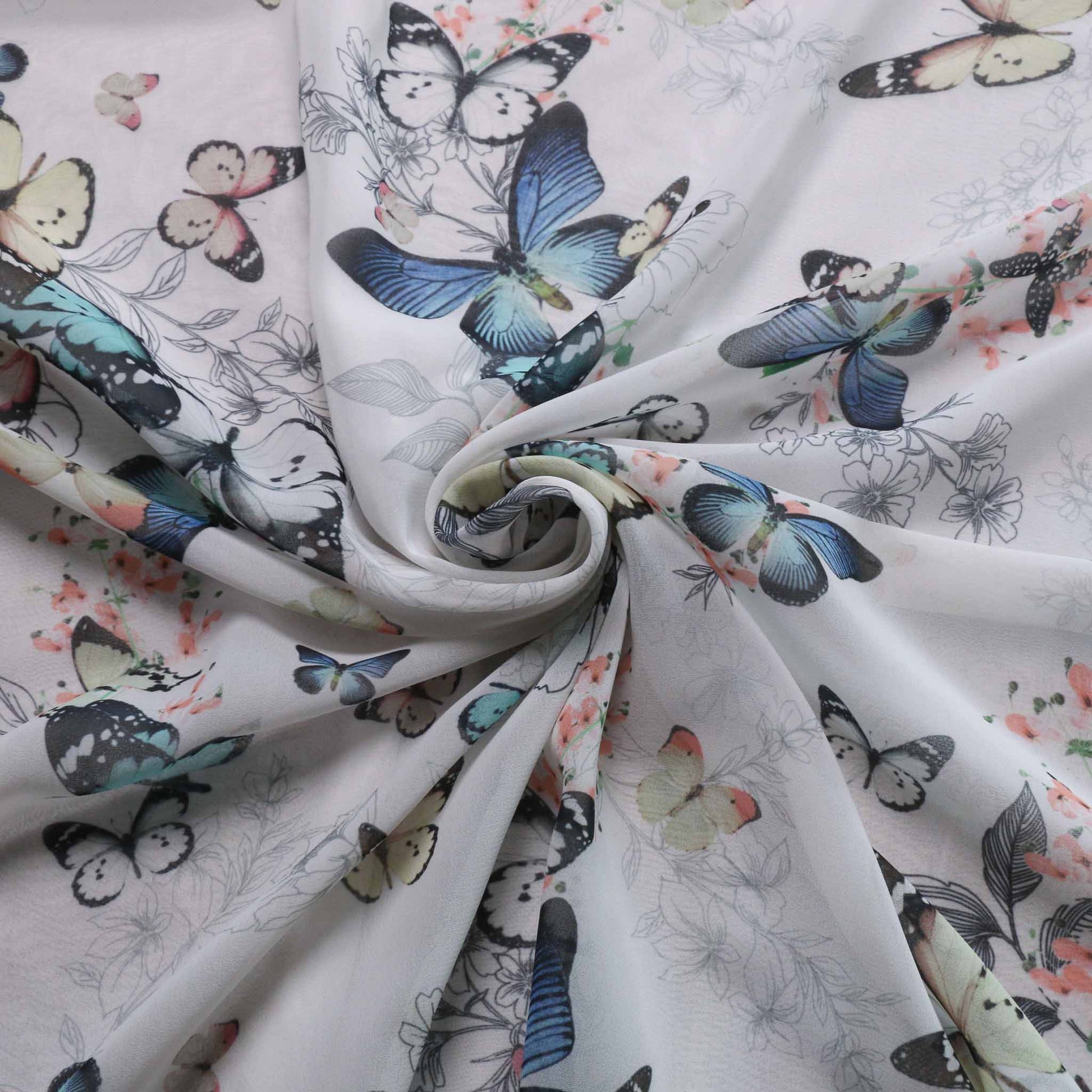 white chiffon dressmaking fabric with blue butterfly print