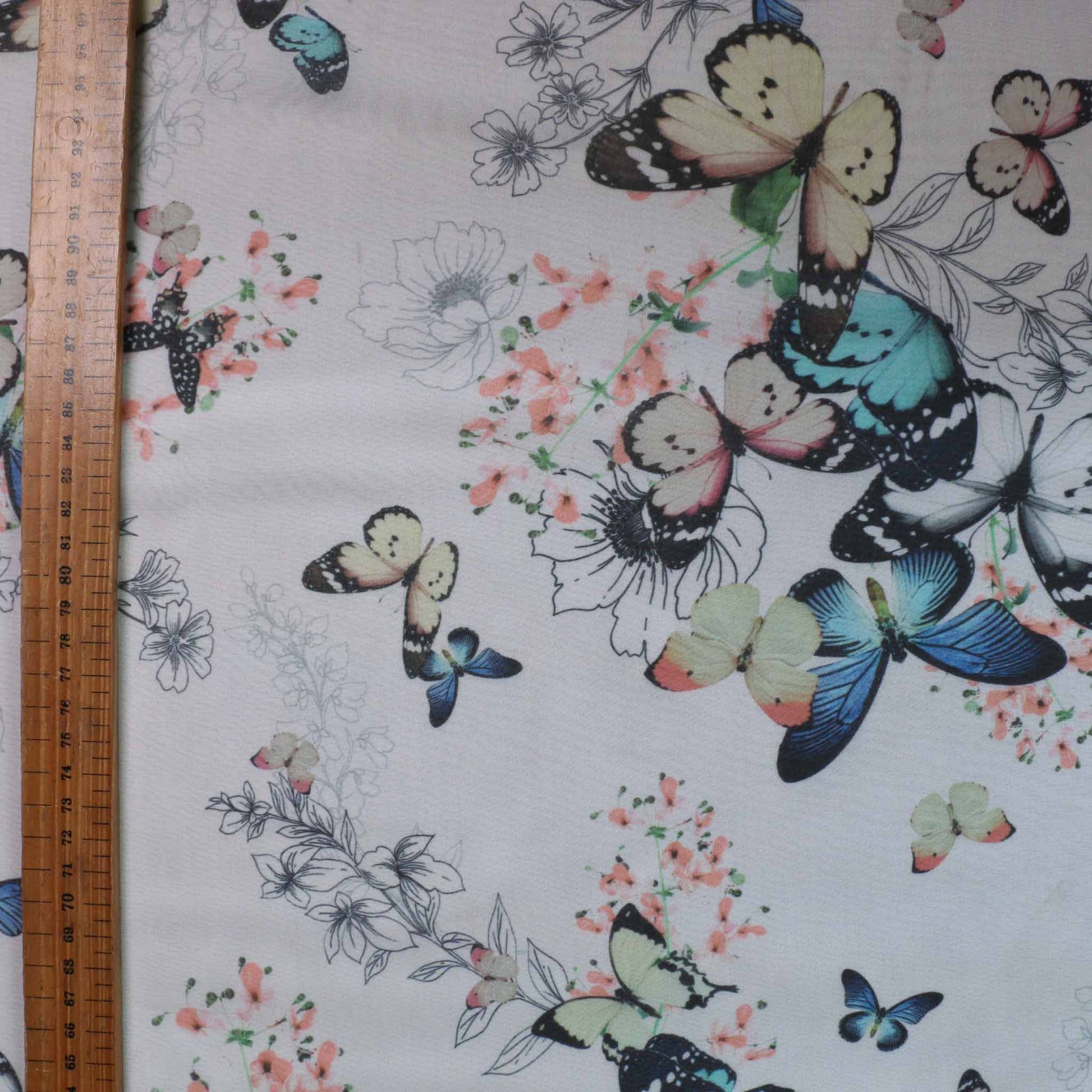 metre white chiffon dressmaking fabric with pastel colour butterfly print