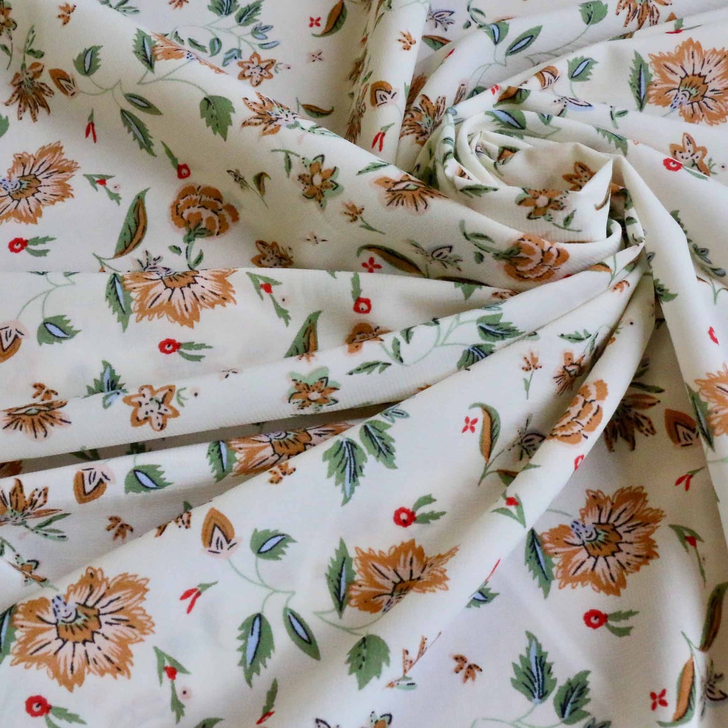 white stretchy chiffon dressmaking fabric with nature inspired floral print