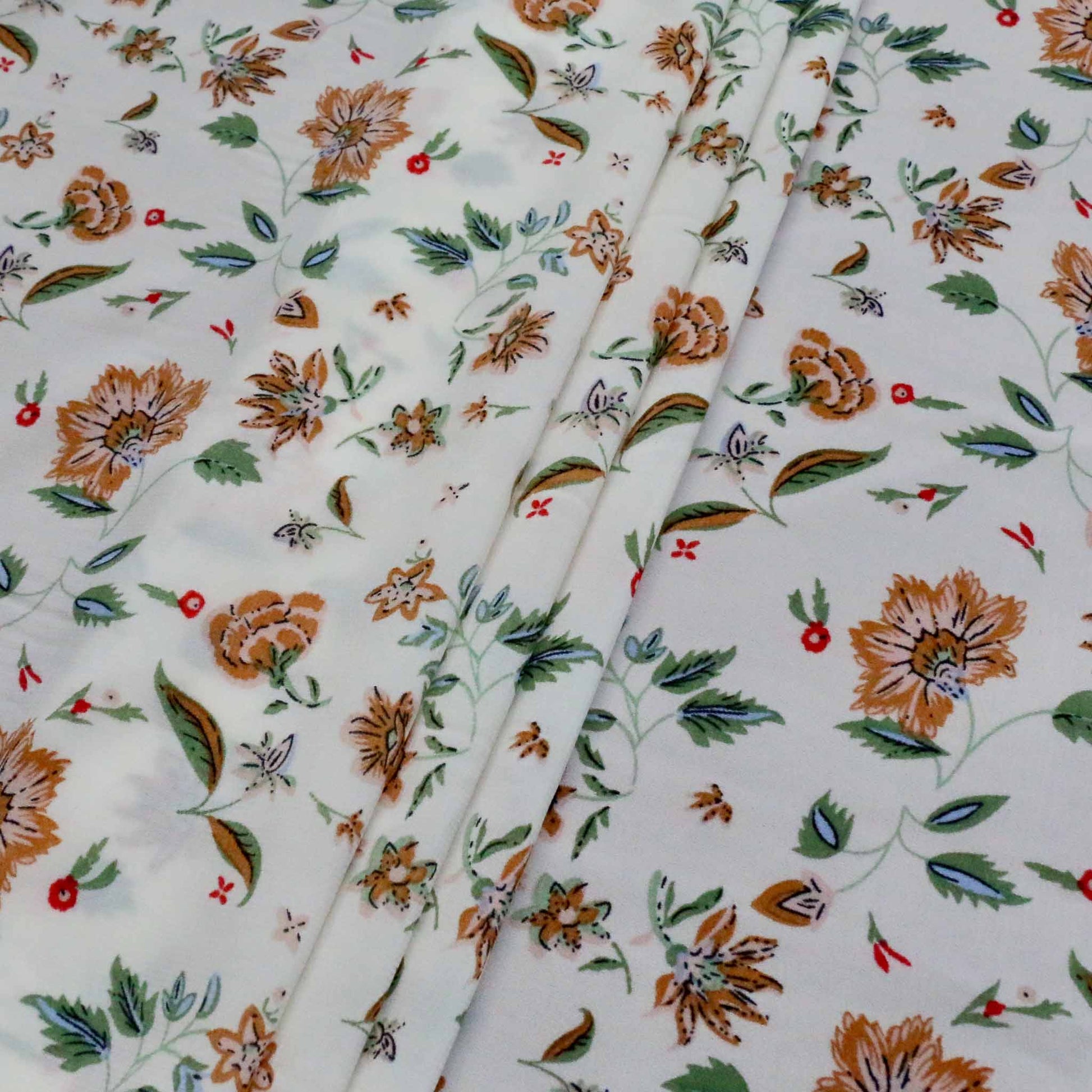 brown and green floral print on white chiffon stretchy dressmaking fabric