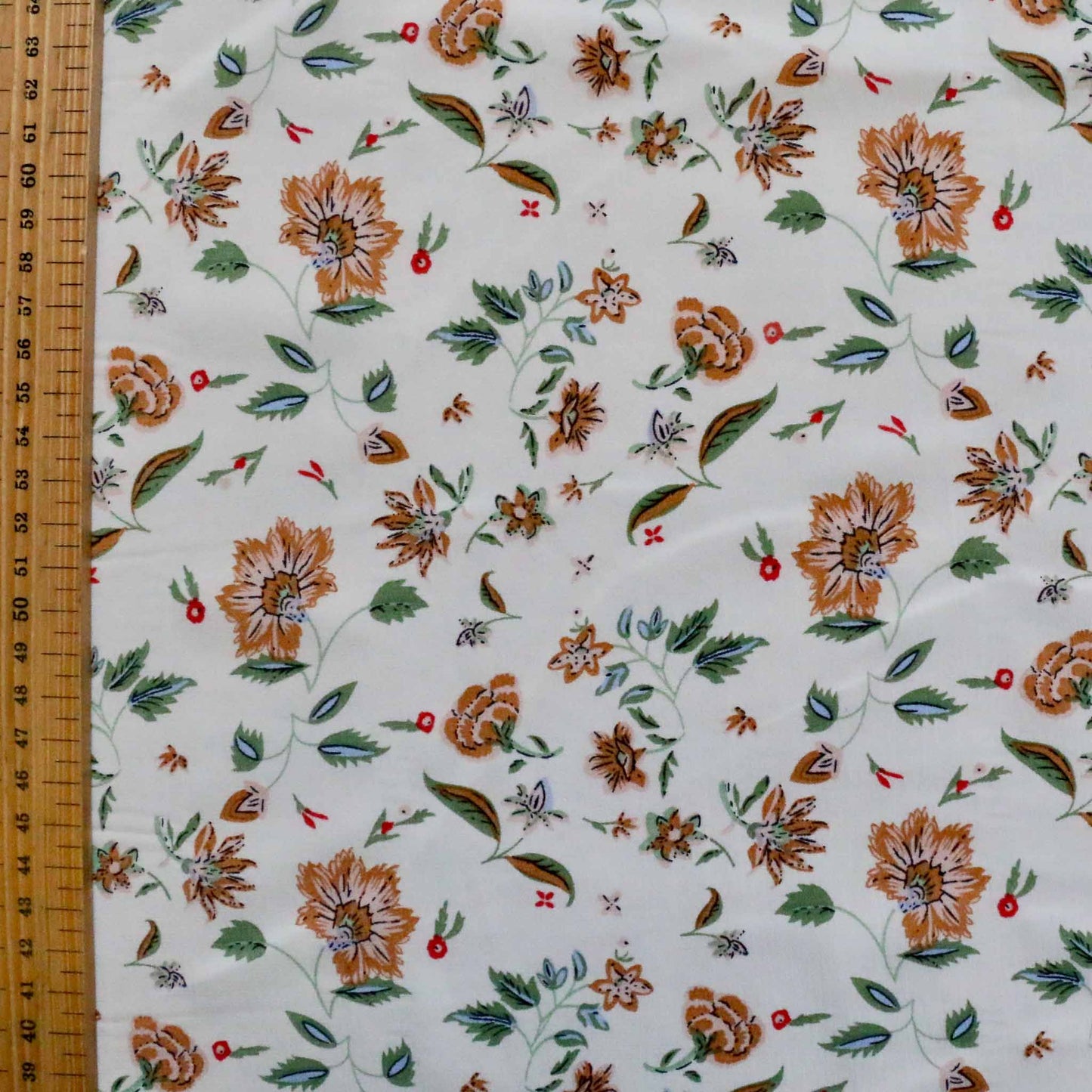 metre white floral chiffon dressmaking fabric with brown and green flower design
