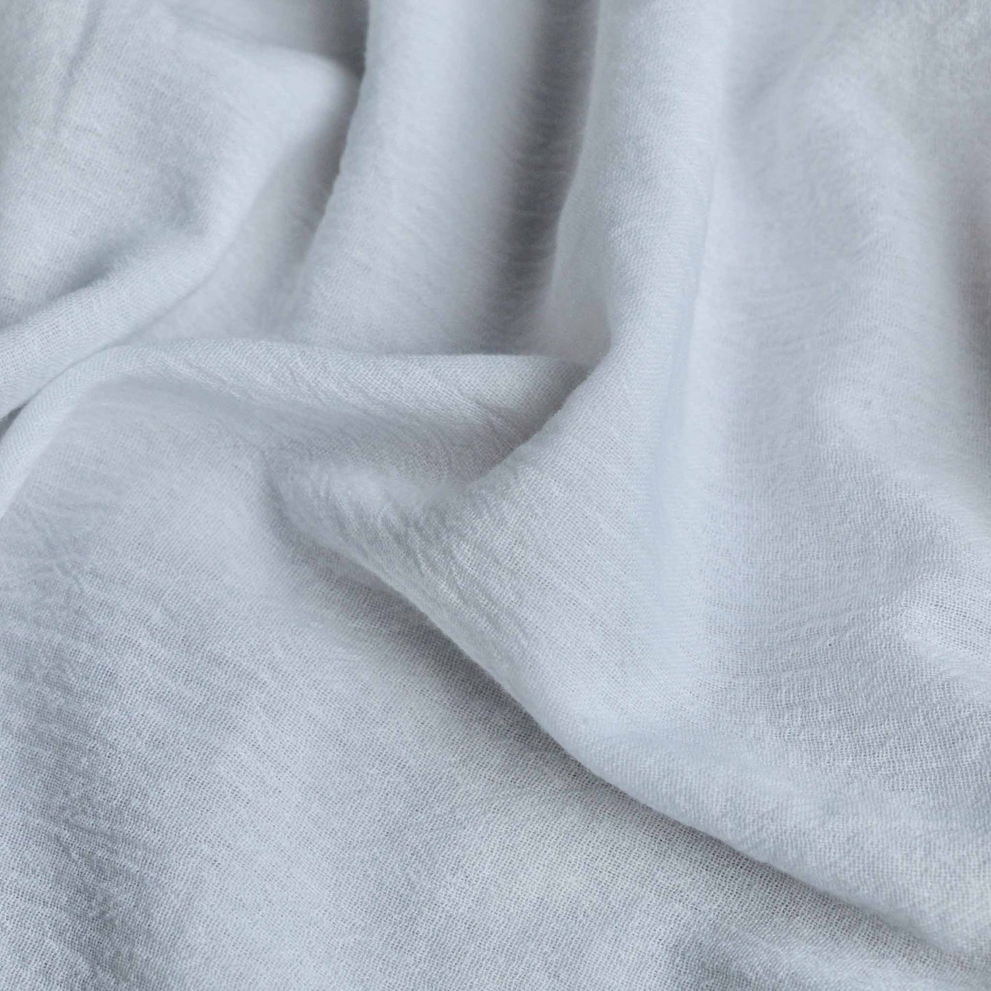 white cotton gauze dressmaking fabric with crinkle effect texture