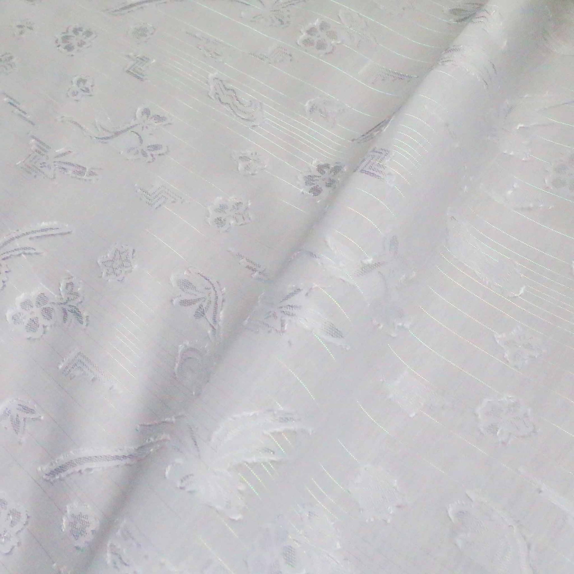 white flocked polycotton dressmaking fabric with silver stipe pattern