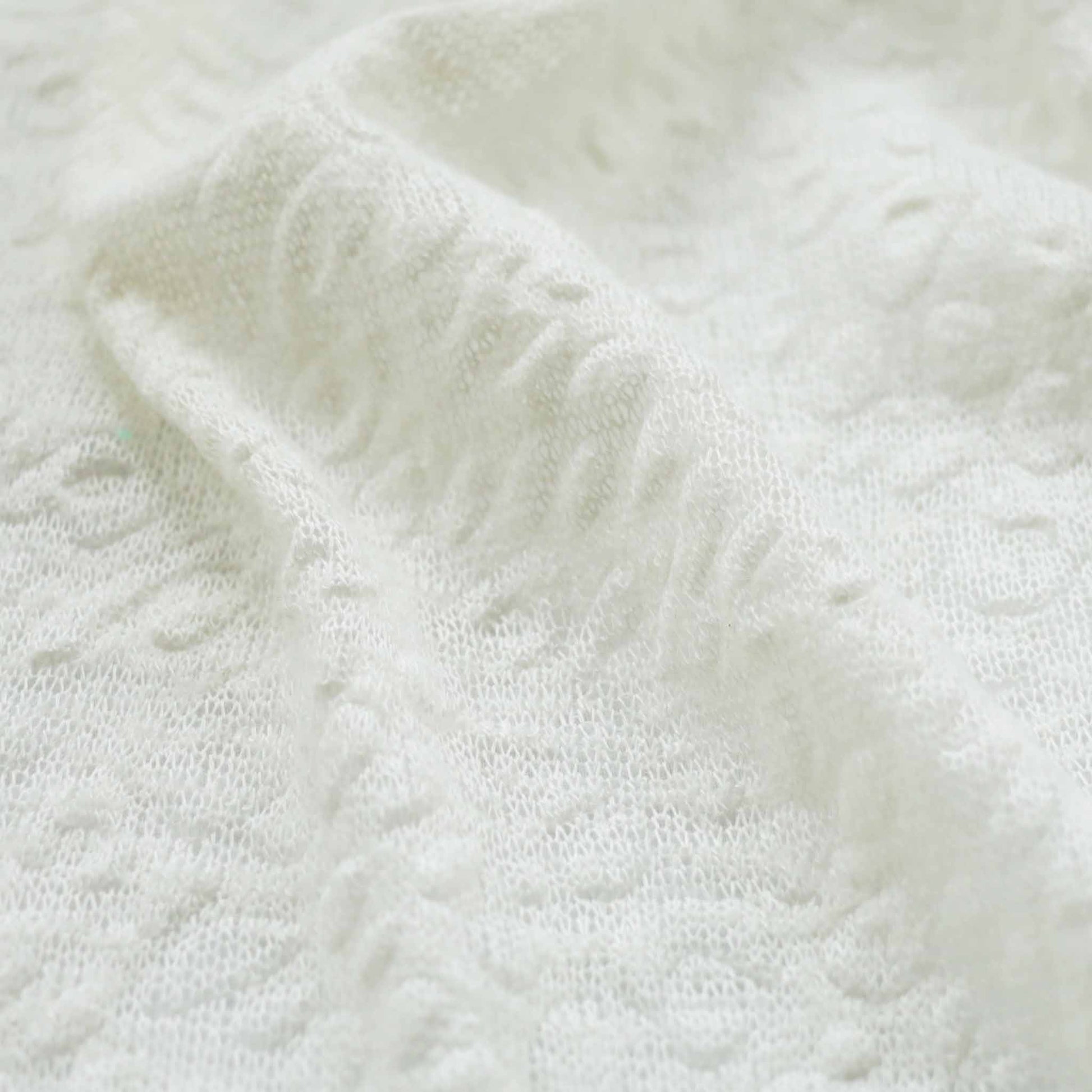 white jersey knit embossed dressmaking fabric