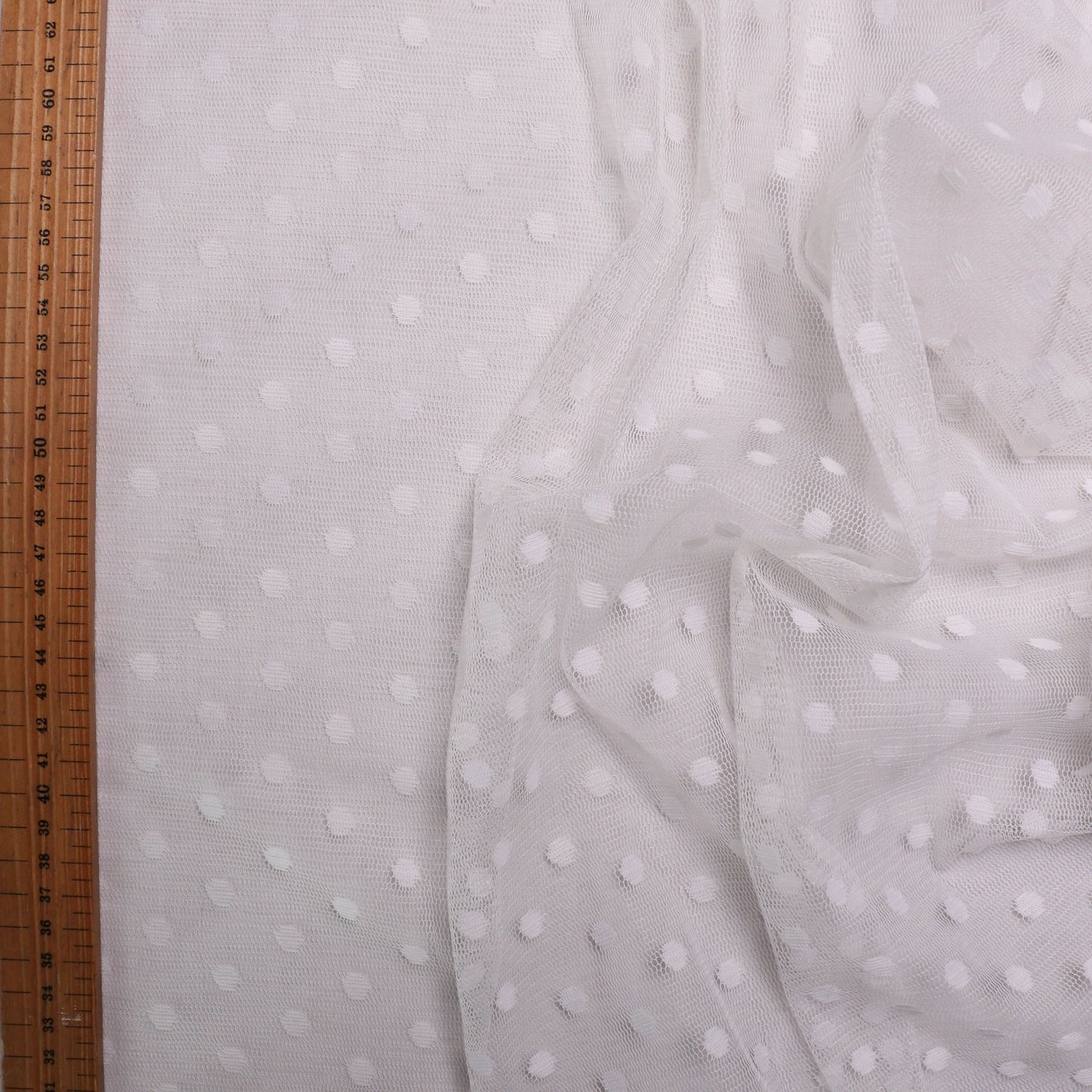 dressmaking fabric mesh with polka dot pattern