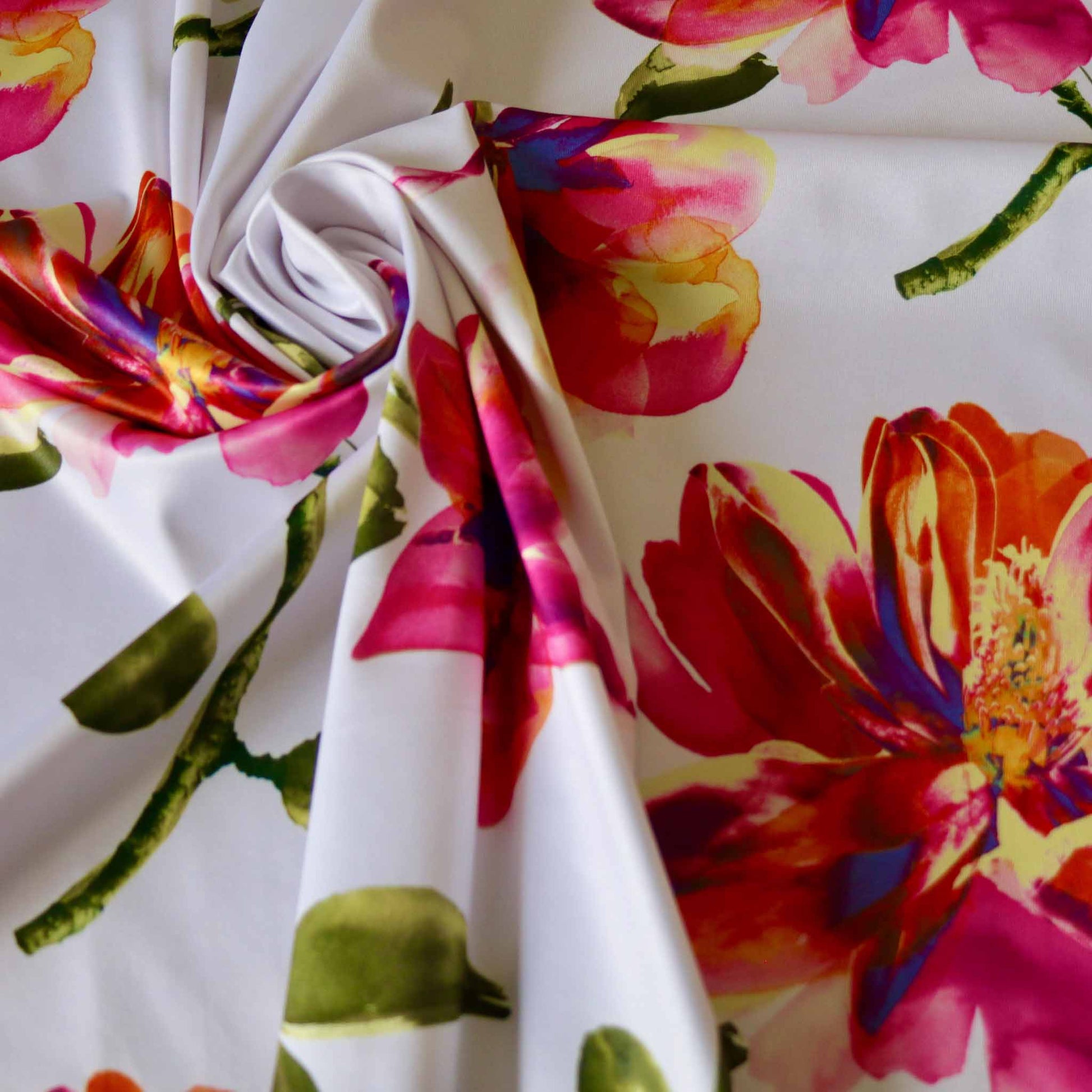 large colourful magnolia floral printed white jersey lycra dressmaking fabric