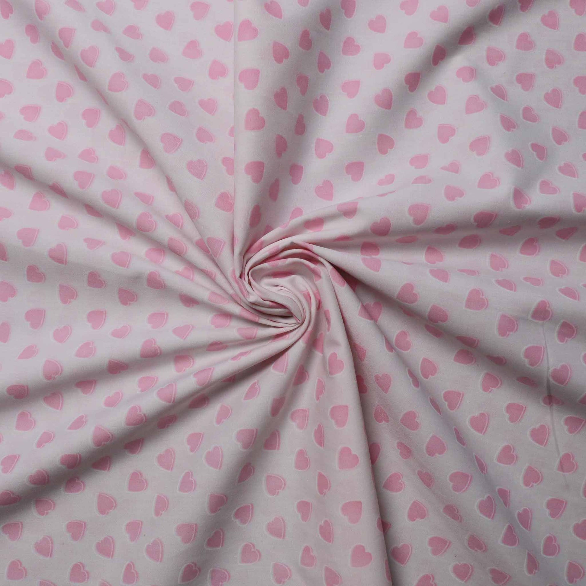polycotton dressmaking fabric with pink love hearts print