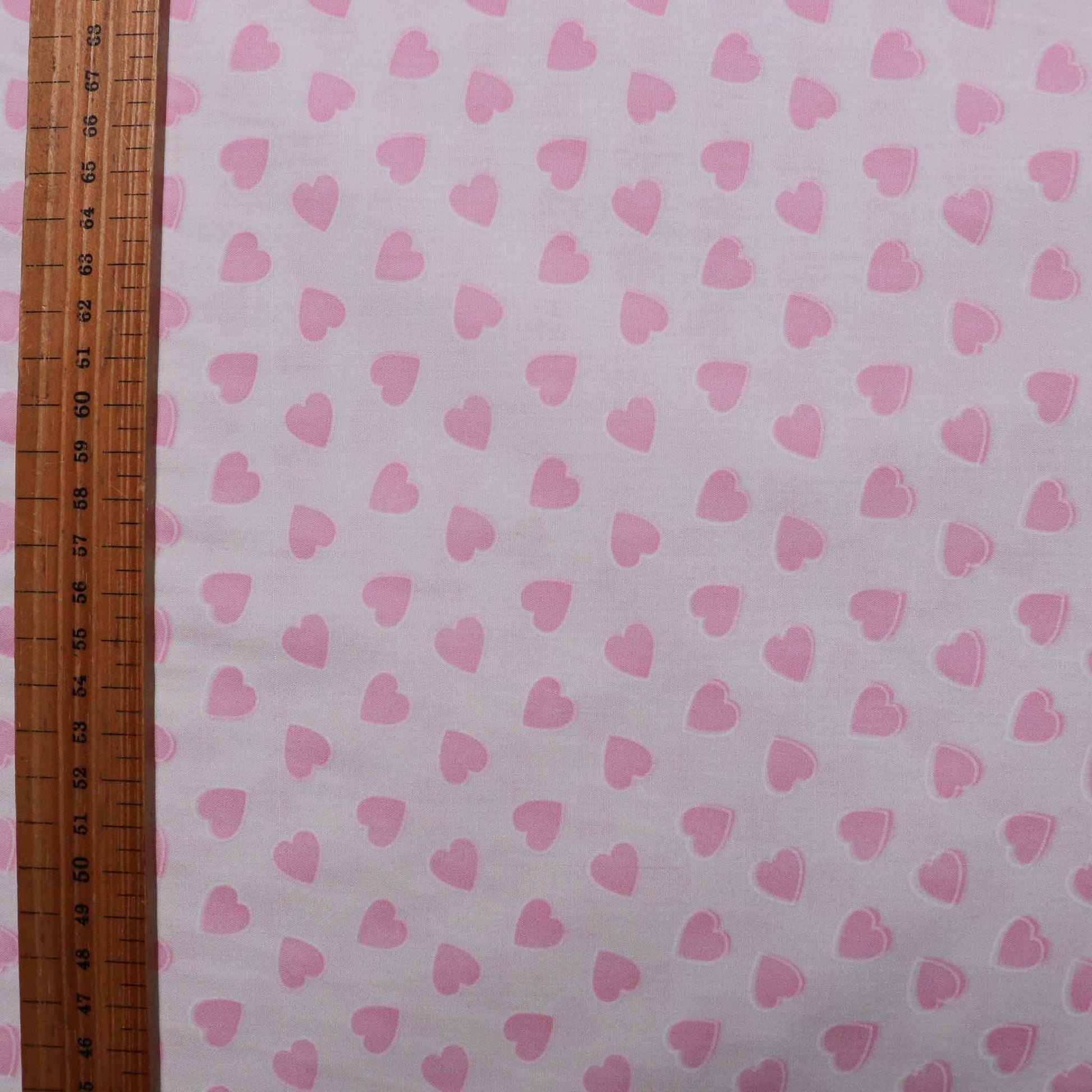 baby pink hearts pattern on white polycotton poplin dressmaking fabric