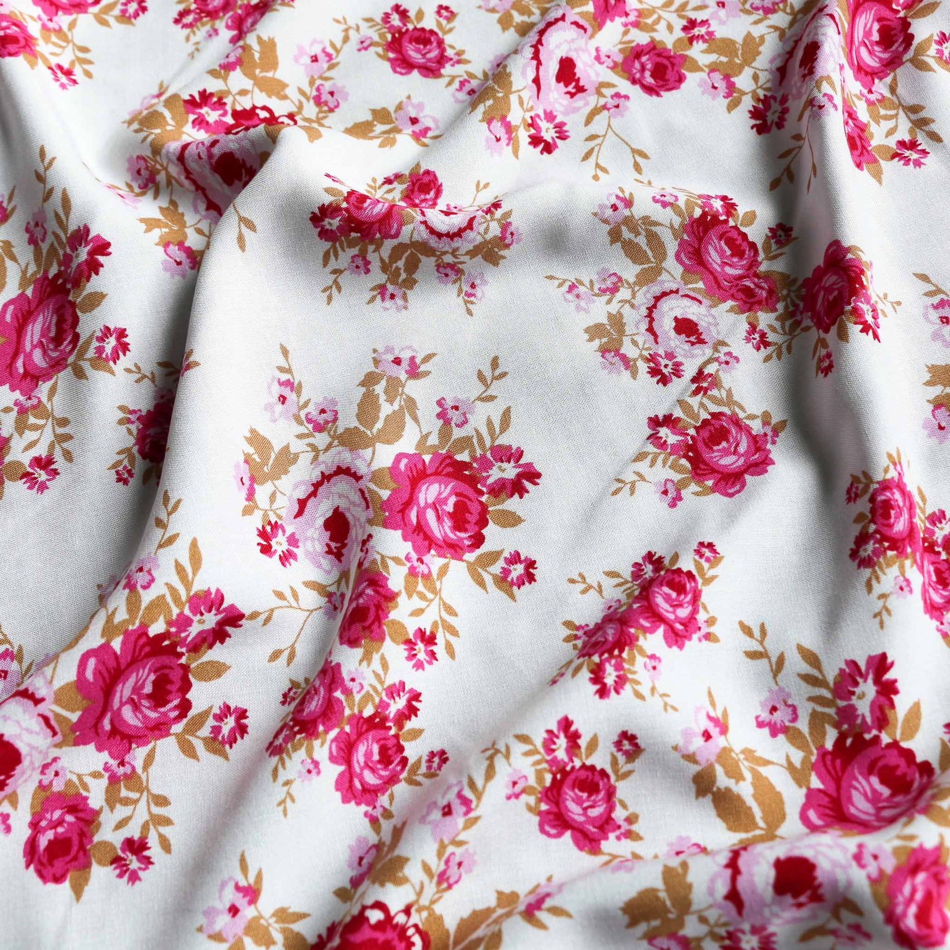 delicate pink roses printed on white viscose challis dressmaking rayon fabric
