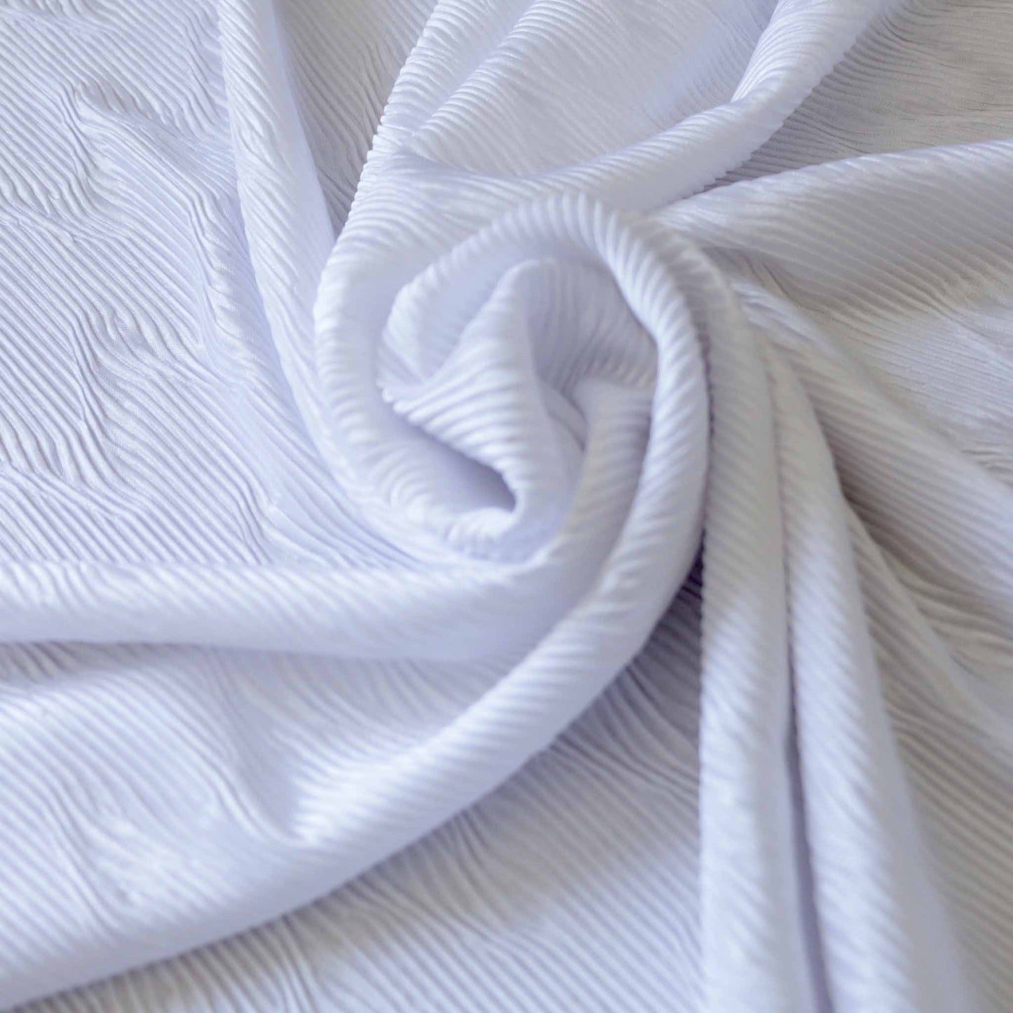 white plisse pleated dressmaking fabric