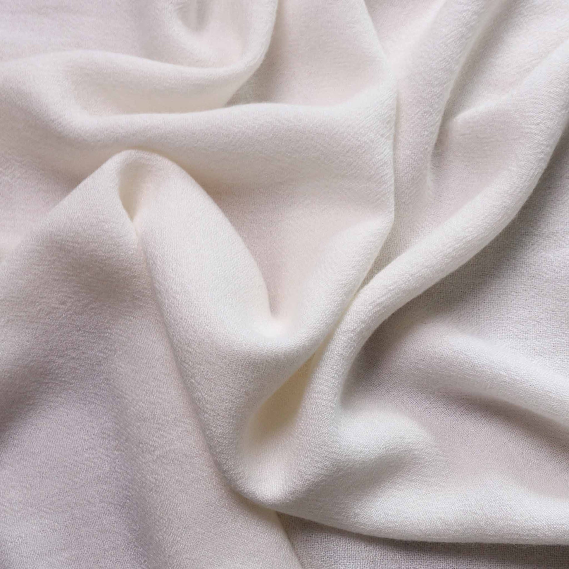 plain off white cheesecloth wool viscose dressmaking fabric