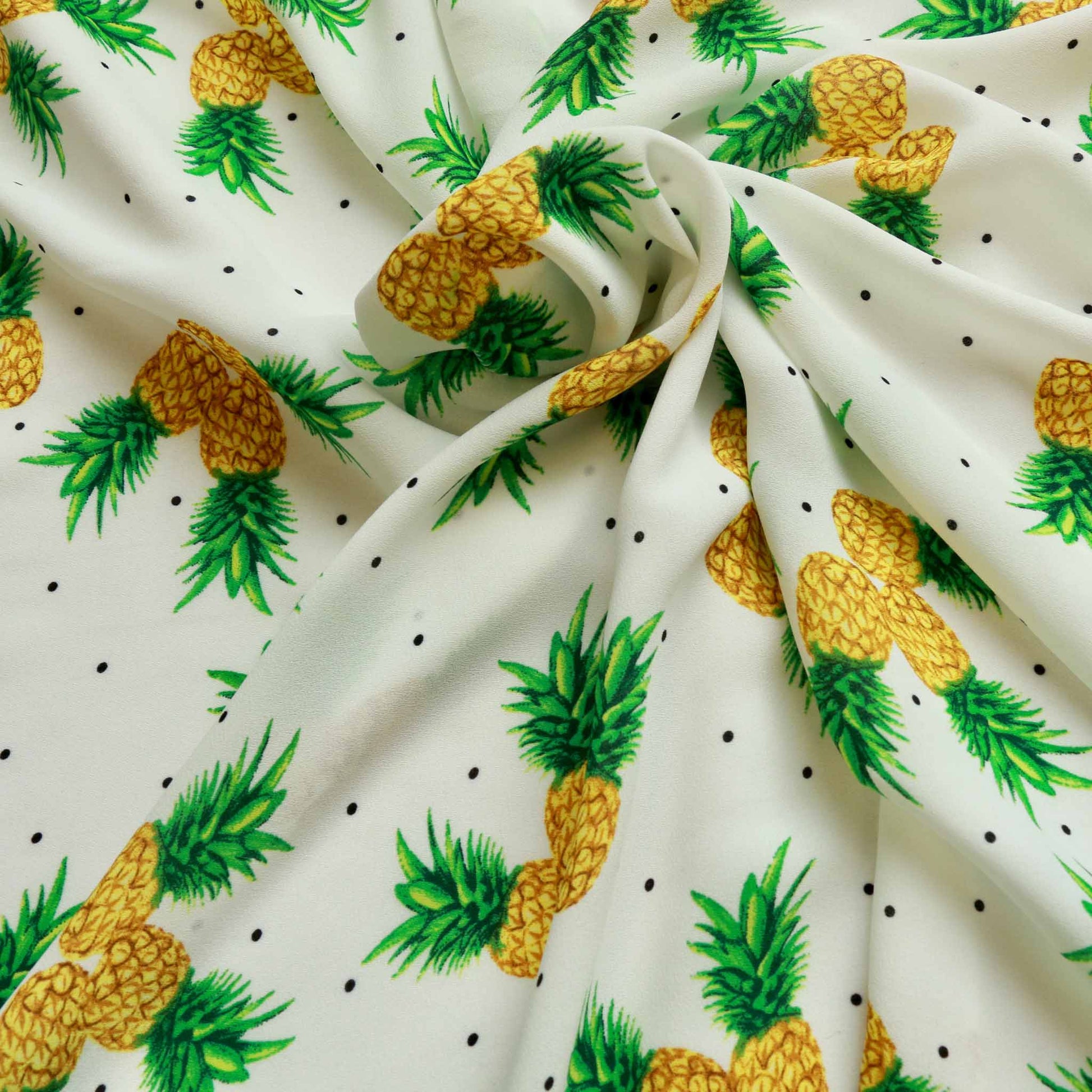 white georgette dressmaking fabric with printed pineapple design