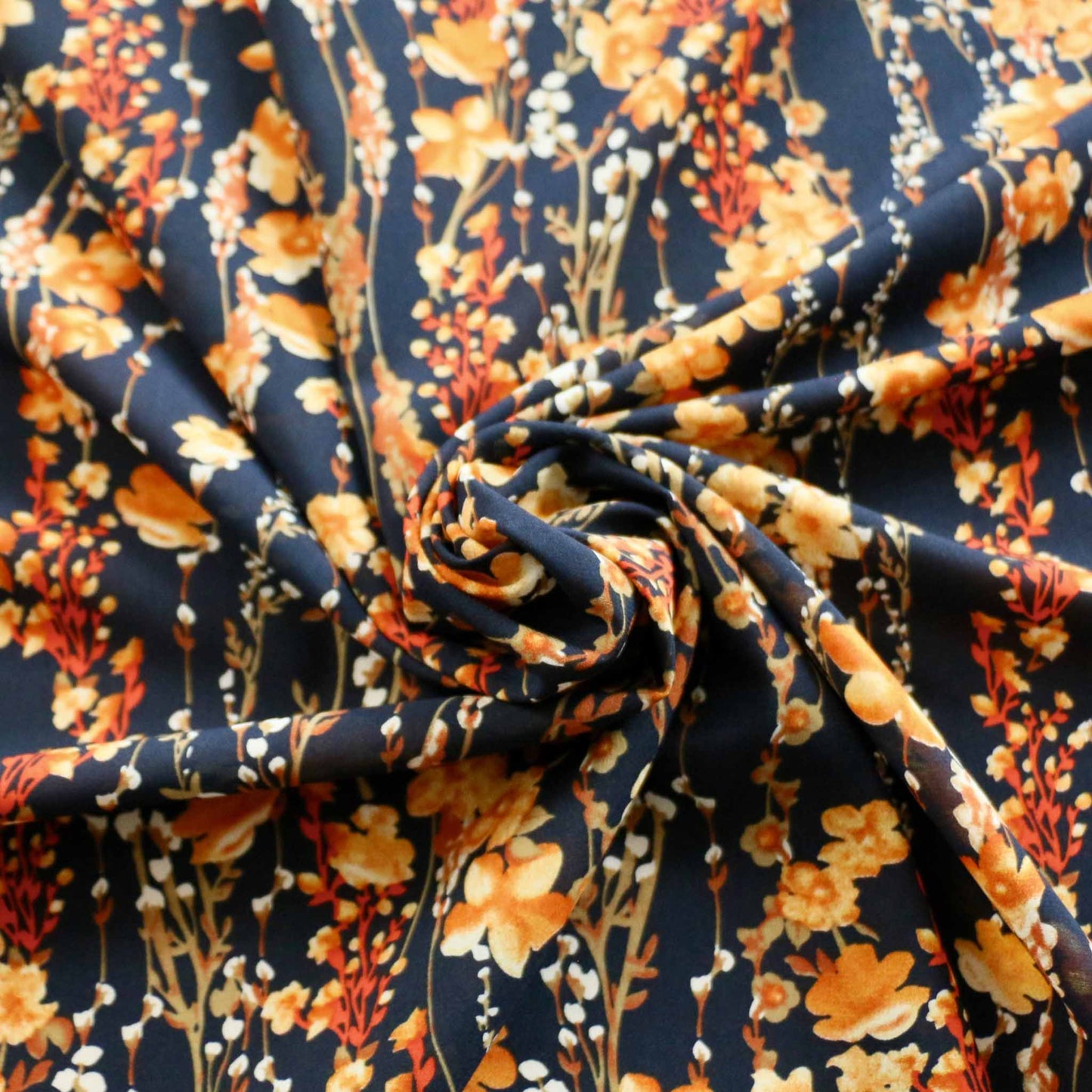 blue stretchy chiffon dressmaking fabric with yellow floral design