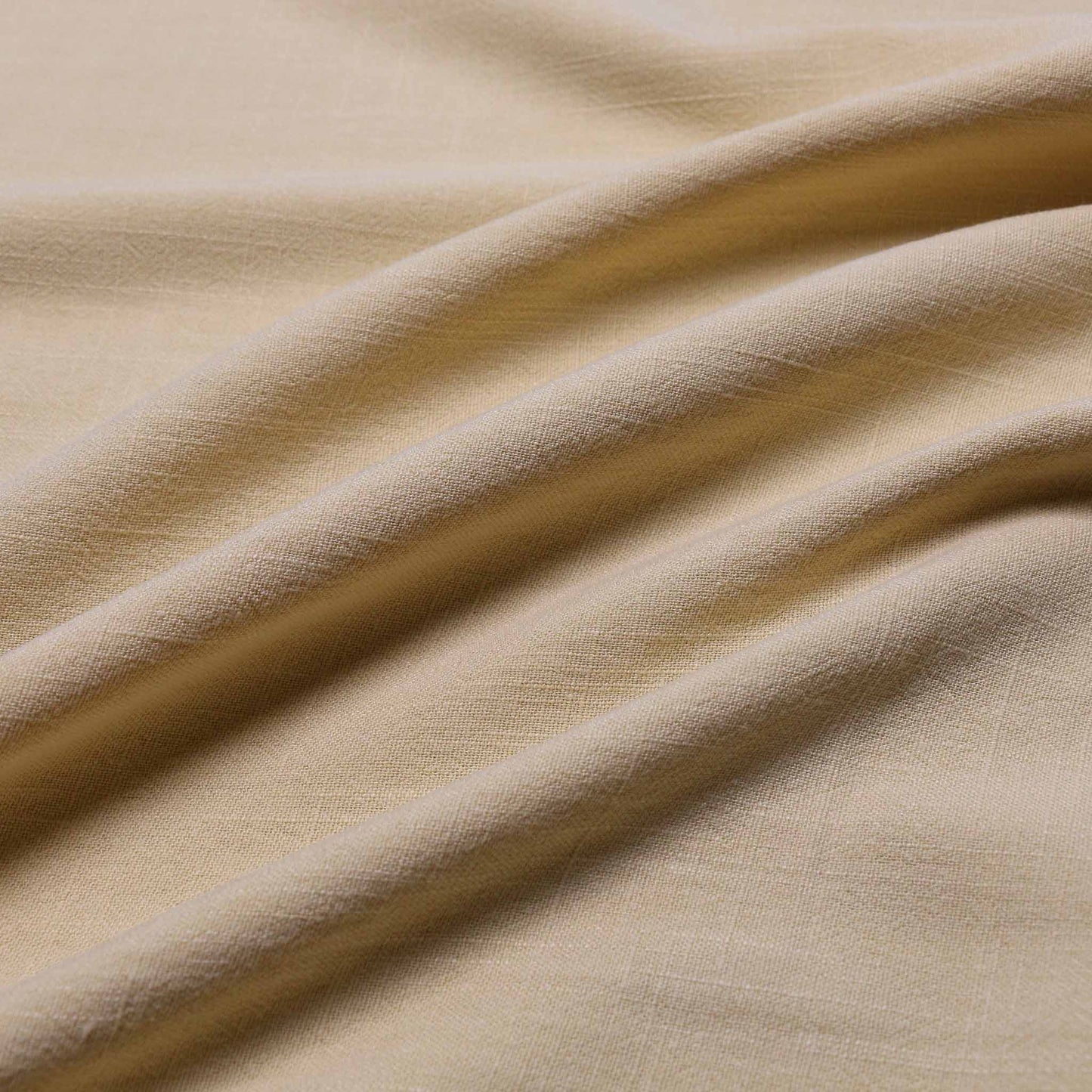 linen viscose fabric for dressmaking in plain pastel yellow colour