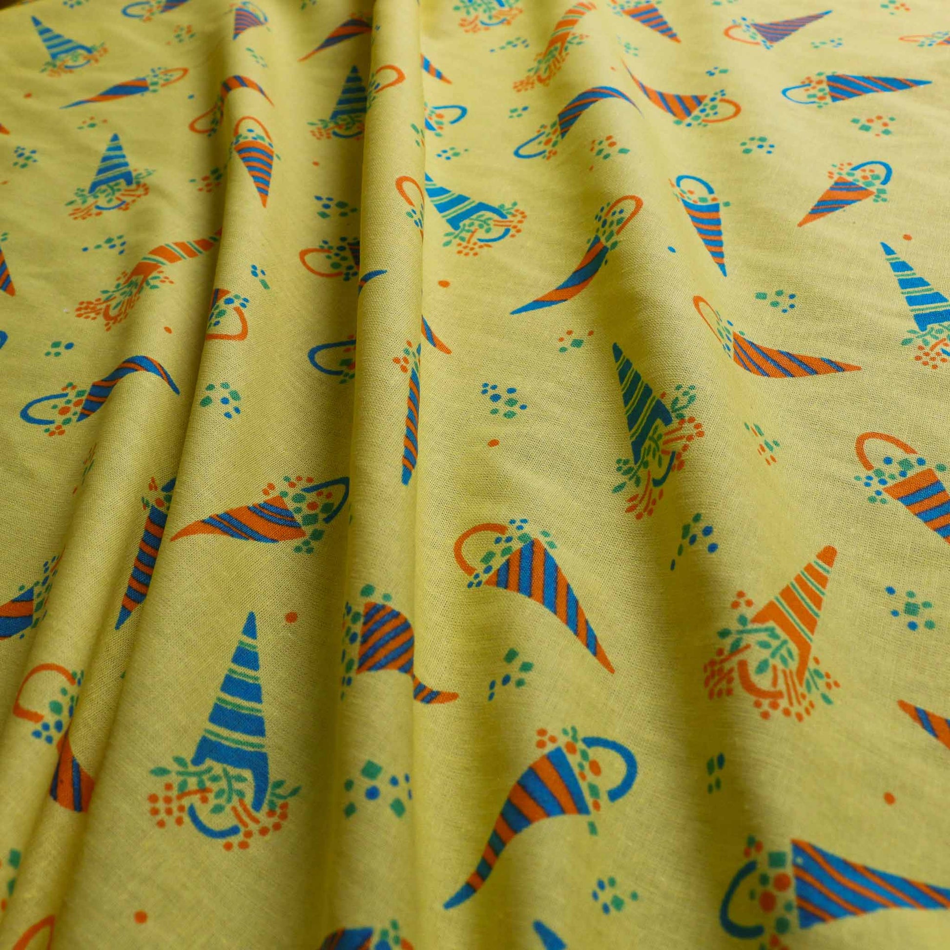 sustainable retro yellow blue cotton poplin dressmaking fabric with ditsy floral print