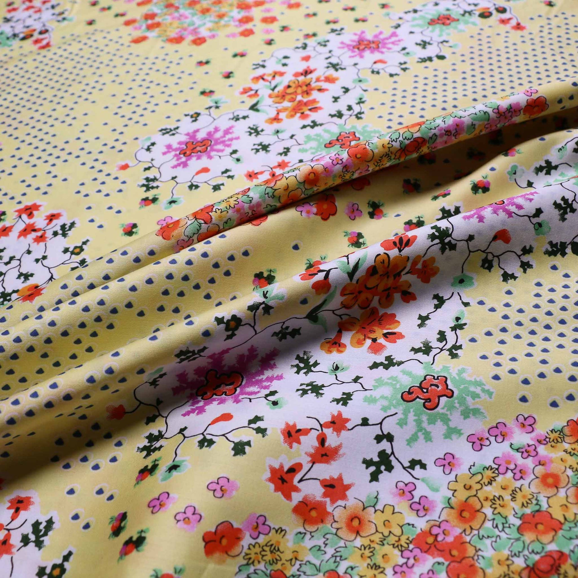 cotton lawn dressmaking fabric in yellow with multicolour floral print